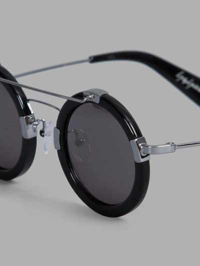 Shop Yohji Yamamoto Black Rounded Sunglasses With Metal Details