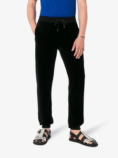 Shop Versace Velour Cotton Blend Sweat Pants In Black