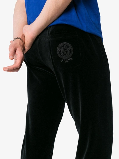 Shop Versace Velour Cotton Blend Sweat Pants In Black