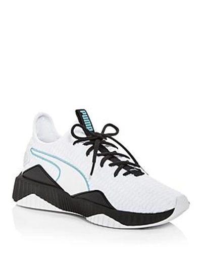 Shop Puma Women's Defy Knit Lace Up Sneakers In White
