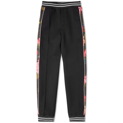 Shop Alexander Mcqueen Floral Taped Jogger In Black