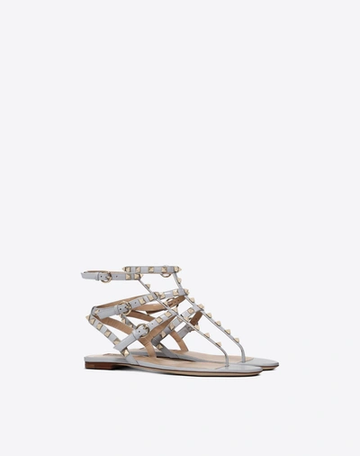 Shop Valentino Garavani Patent Rockstud Flat Sandal In Pastel Gray