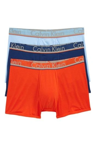 Shop Calvin Klein 3-pack Comfort Microfiber Trunks In Rapid Ble/ Estate Ble/ Oriole