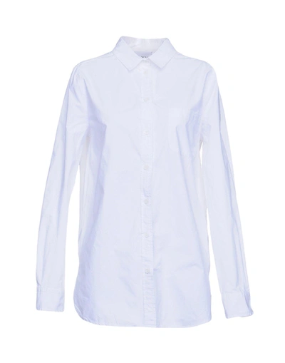 Shop Ganni Solid Color Shirts & Blouses In White