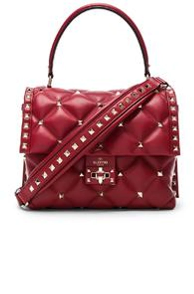 Shop Valentino Candystud Top Handle Bag In Red