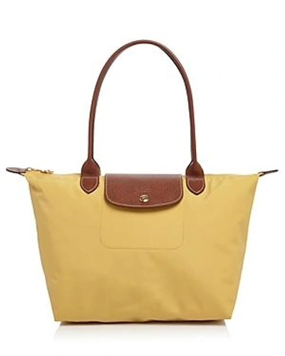 Shop Longchamp Le Pliage Medium Nylon Tote In Curry/gold