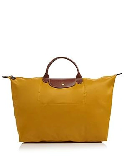 Shop Longchamp Le Pliage Nylon Travel Bag In Sunshine Yellow/gold