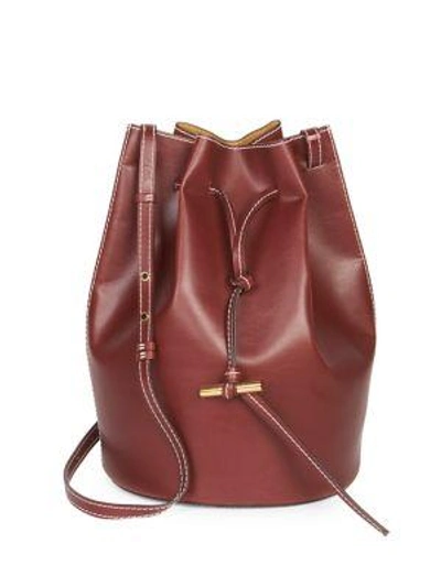 Shop Stella Mccartney Faux Leather Medium Belted Bucket Bag In Cherry
