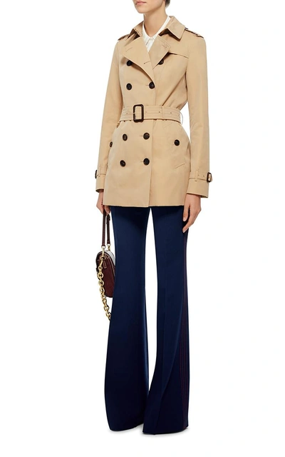 Shop Burberry Sandringham Double Breasted Trench Coat In Tan