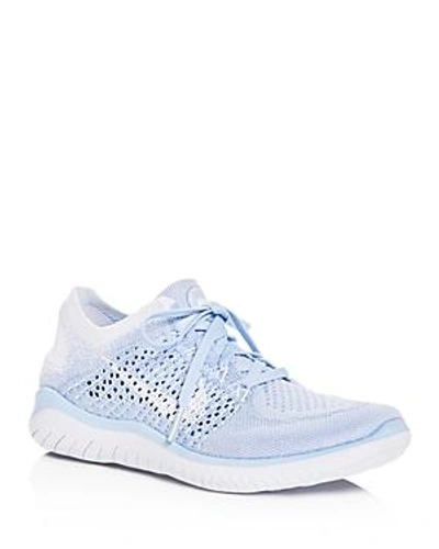Shop Nike Women's Free Rn Flyknit 2018 Lace Up Sneakers In Blue/white