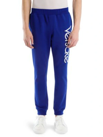 Shop Versace Cotton Logo Sweatpants In Bluette Bianco