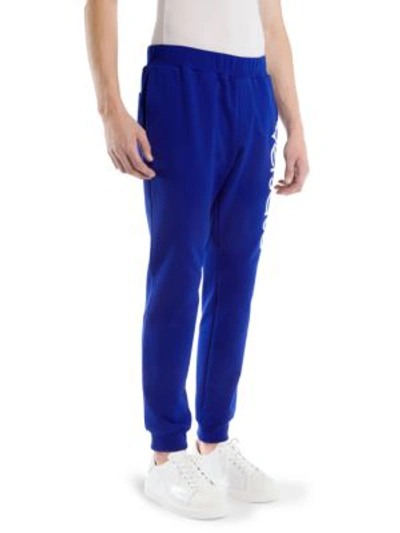 Shop Versace Cotton Logo Sweatpants In Bluette Bianco