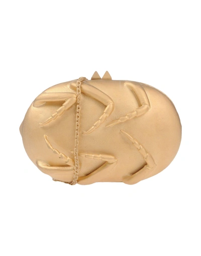 Shop Valentino Handbag In Gold
