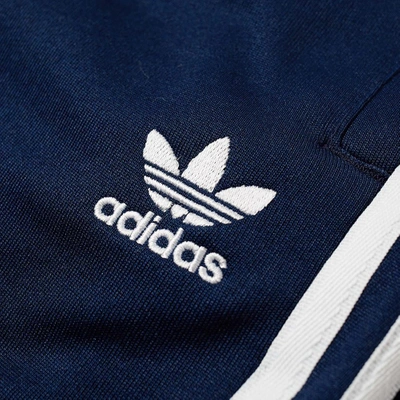 Shop Adidas Originals Adidas Superstar Track Pant In Blue