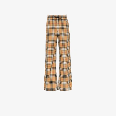 Shop Burberry Vintage Check Drawcord Trousers In Yellow&orange