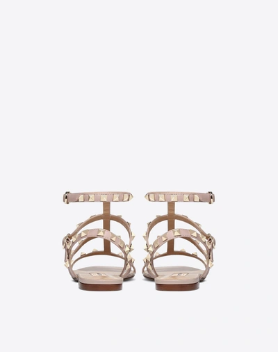 Shop Valentino Garavani Rockstud Flat Calfskin Sandal With Straps In Poudre