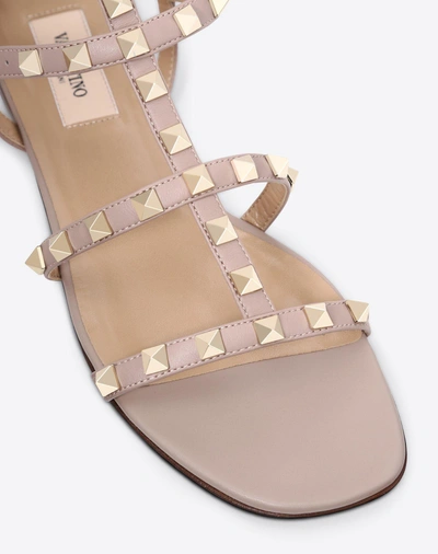 Shop Valentino Garavani Rockstud Flat Calfskin Sandal With Straps In Poudre