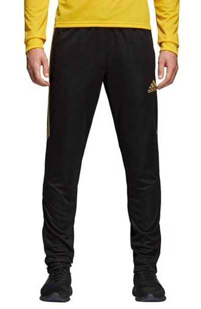 Shop Adidas Originals Tiro 17 Regular Fit Track Pants In Black/ Gold Met.