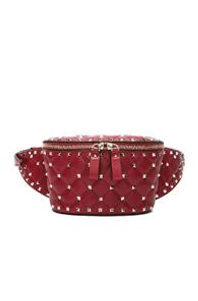 Shop Valentino Small Quilted Rockstud Spike Belt Bag In Red