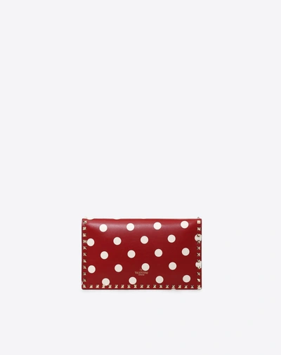 Shop Valentino Polka Dot Rockstud Wristlet Clutch In Red