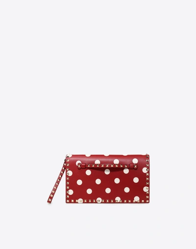 Shop Valentino Polka Dot Rockstud Wristlet Clutch In Red