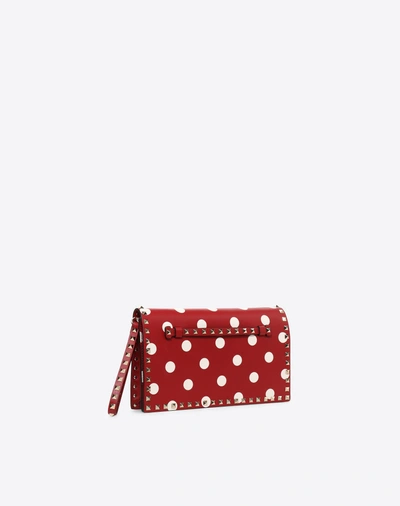 Shop Valentino Polka Dot Rockstud Wristlet Clutch In Red