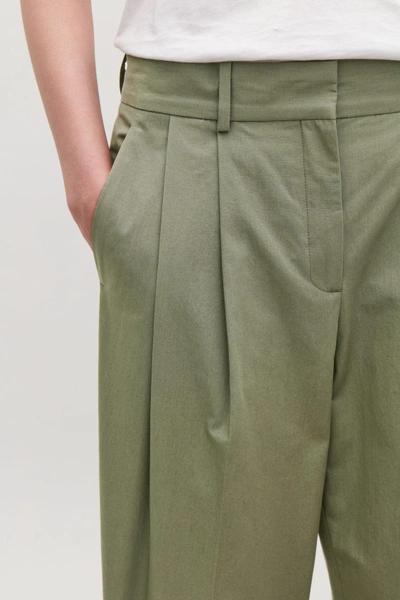 Shop Cos Dense Cotton Trousers In Green