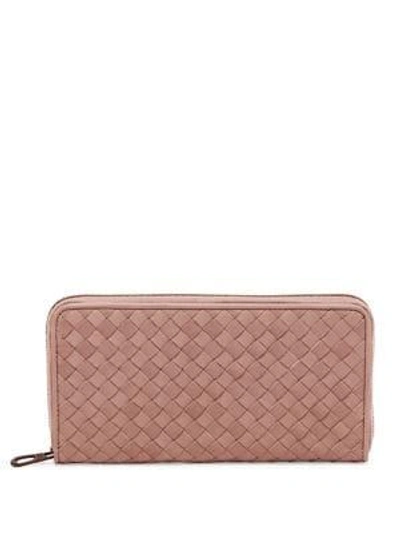Shop Bottega Veneta Zip-around Leather Woven Wallet In Red Pink