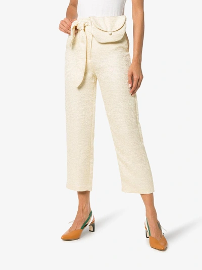 Shop Nanushka Raimo Belted Cropped Judo Trousers In Nude/neutrals