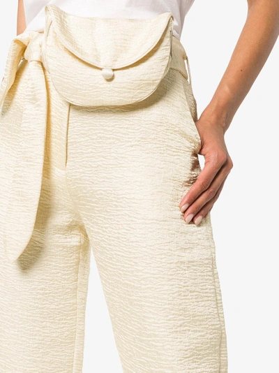 Shop Nanushka Raimo Belted Cropped Judo Trousers In Nude/neutrals