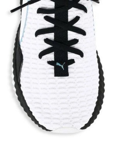 Shop Puma Defy Wings Textured Stripe Sneakers In White