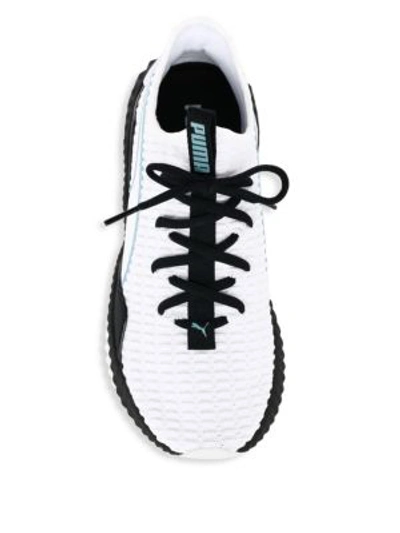 Shop Puma Defy Wings Textured Stripe Sneakers In White