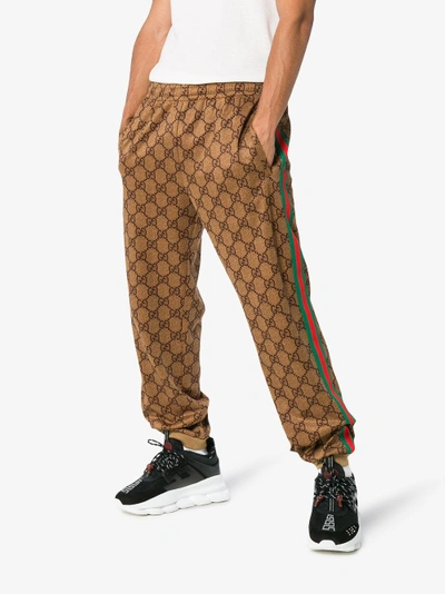 Shop Gucci Gg Supreme Print Cotton Blend Sweat Pants In Brown