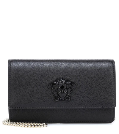 Shop Versace Palazzo Leather Clutch In Black