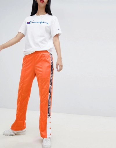 Shop Champion Popper Tracksuit Bottoms With Logo Taping - Orange