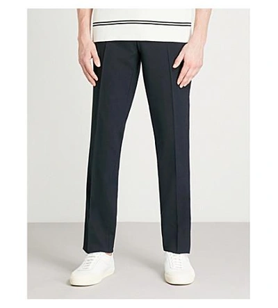 Shop Sandro Slim-fit Tapered Stretch-wool Trousers In Marine