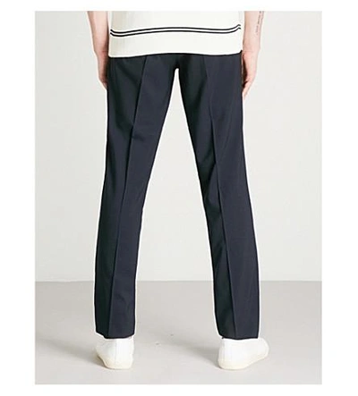 Shop Sandro Slim-fit Tapered Stretch-wool Trousers In Marine