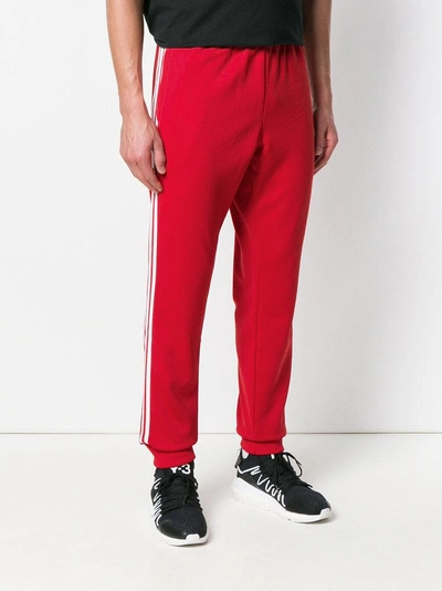 Shop Adidas Originals Adidas Sst Track Trousers - Red