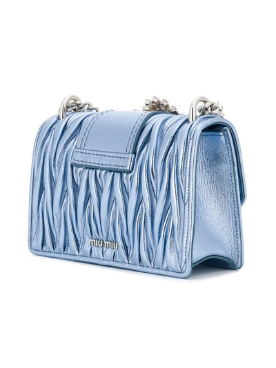 Shop Miu Miu Matelassé Crystal Buckle Shoulder Bag - Blue
