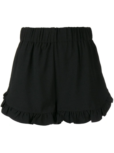 Shop Ganni Ruffled Hem Shorts - Black