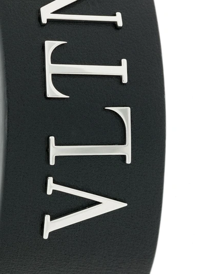 Shop Valentino Garavani Logo Cuff Bracelet - Black