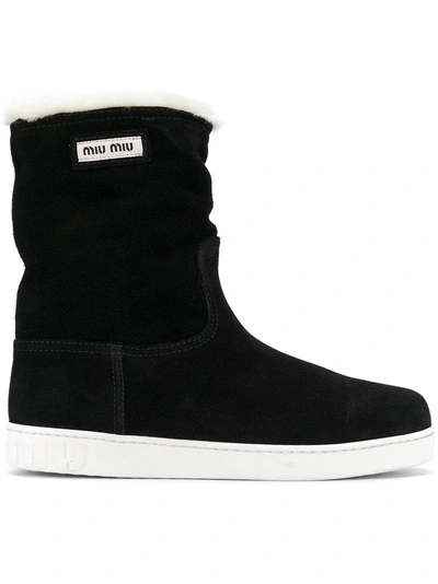 Shop Miu Miu Mid-calf Flat Boots - Black