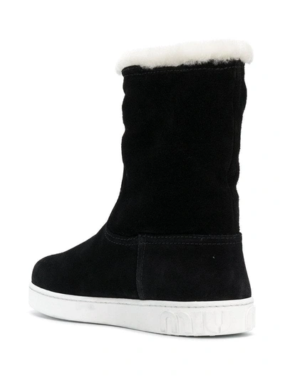 Shop Miu Miu Mid-calf Flat Boots - Black