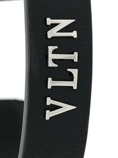 Shop Valentino Garavani Logo Cuff Bracelet - Black