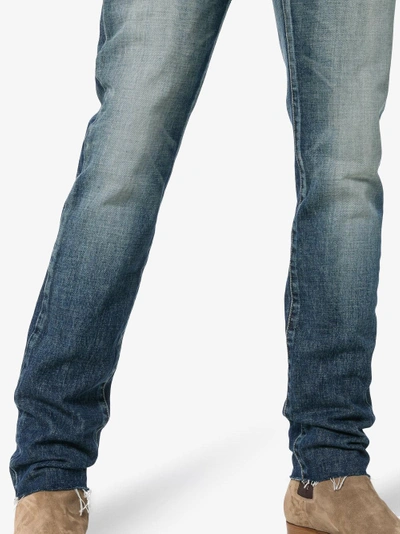 Shop Saint Laurent Skinny Distressed Jeans In Blue