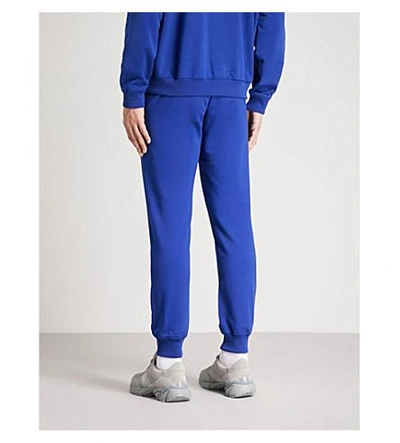 Shop Versace Logo-embroidered Cotton-jersey Jogging Bottoms In Blue White