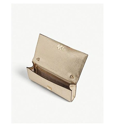 Shop Michael Michael Kors Michael Kors Pale Gold Mott Metallic-leather Clutch Bag