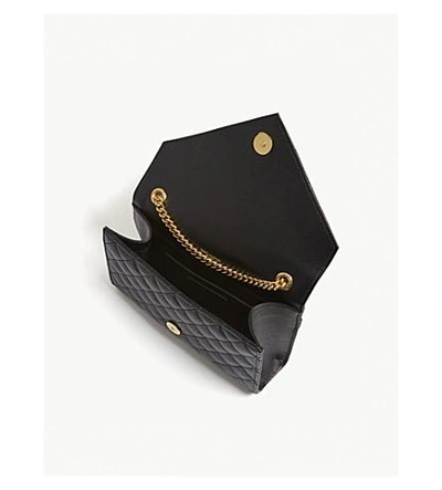 Shop Saint Laurent Black And Gold Monogram Quilted Pebbled Leather Satchel In Black/gold