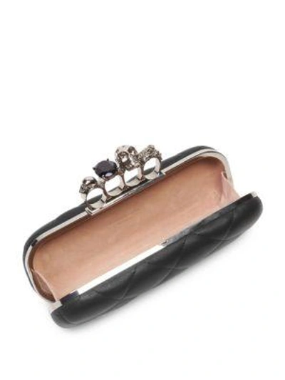 Shop Alexander Mcqueen Four-ring Matelasse Embellished Leather Clutch In Black