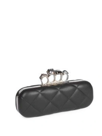 Shop Alexander Mcqueen Four-ring Matelasse Embellished Leather Clutch In Black